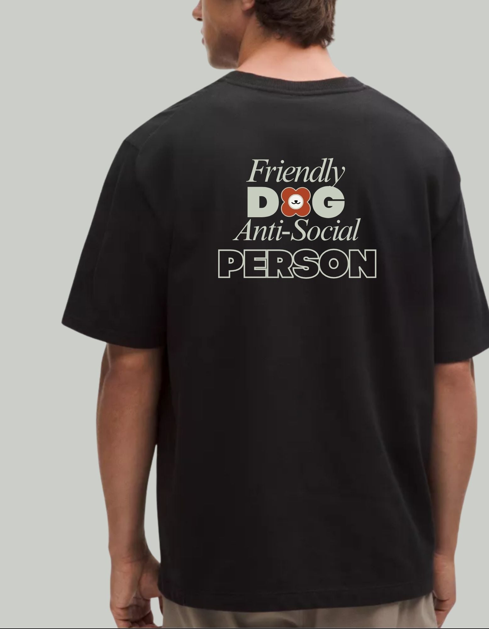 Person wearing a black tee shirt with text 'Friendly Dog Anti-Social Person' on the back. 100% cotton 210gsm.