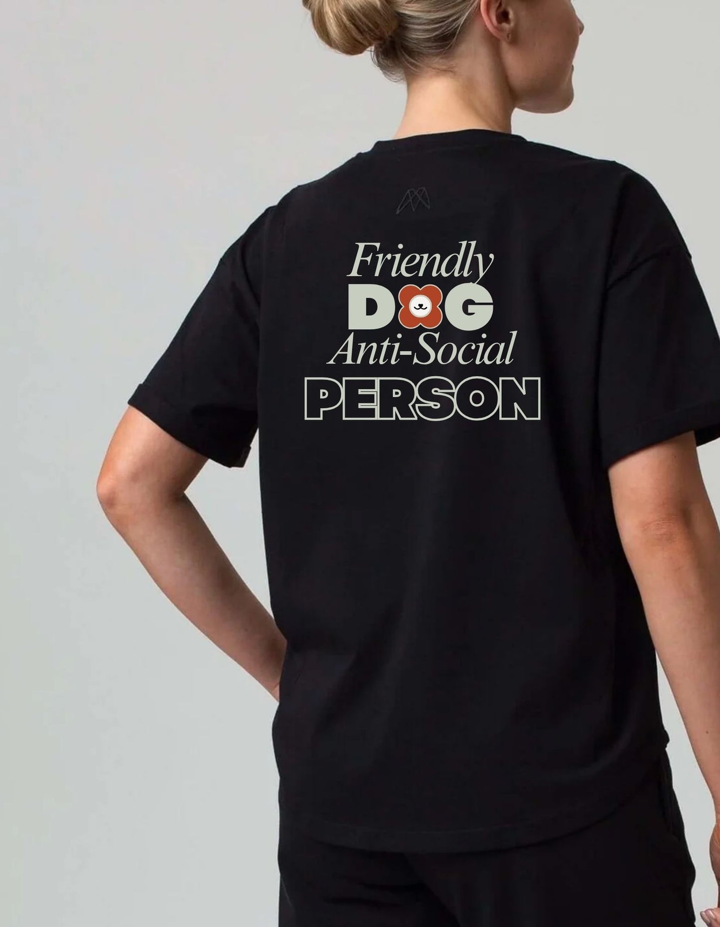 Person wearing a black tee shirt with text 'Friendly Dog Anti-Social Person' on the back. 100% cotton 210gsm.