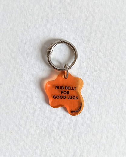 twinning orange acrylic pet collar charm "Rub belly for good luck" for cats and dogs with  matching bag charm "Slightly superstitious" for hooman