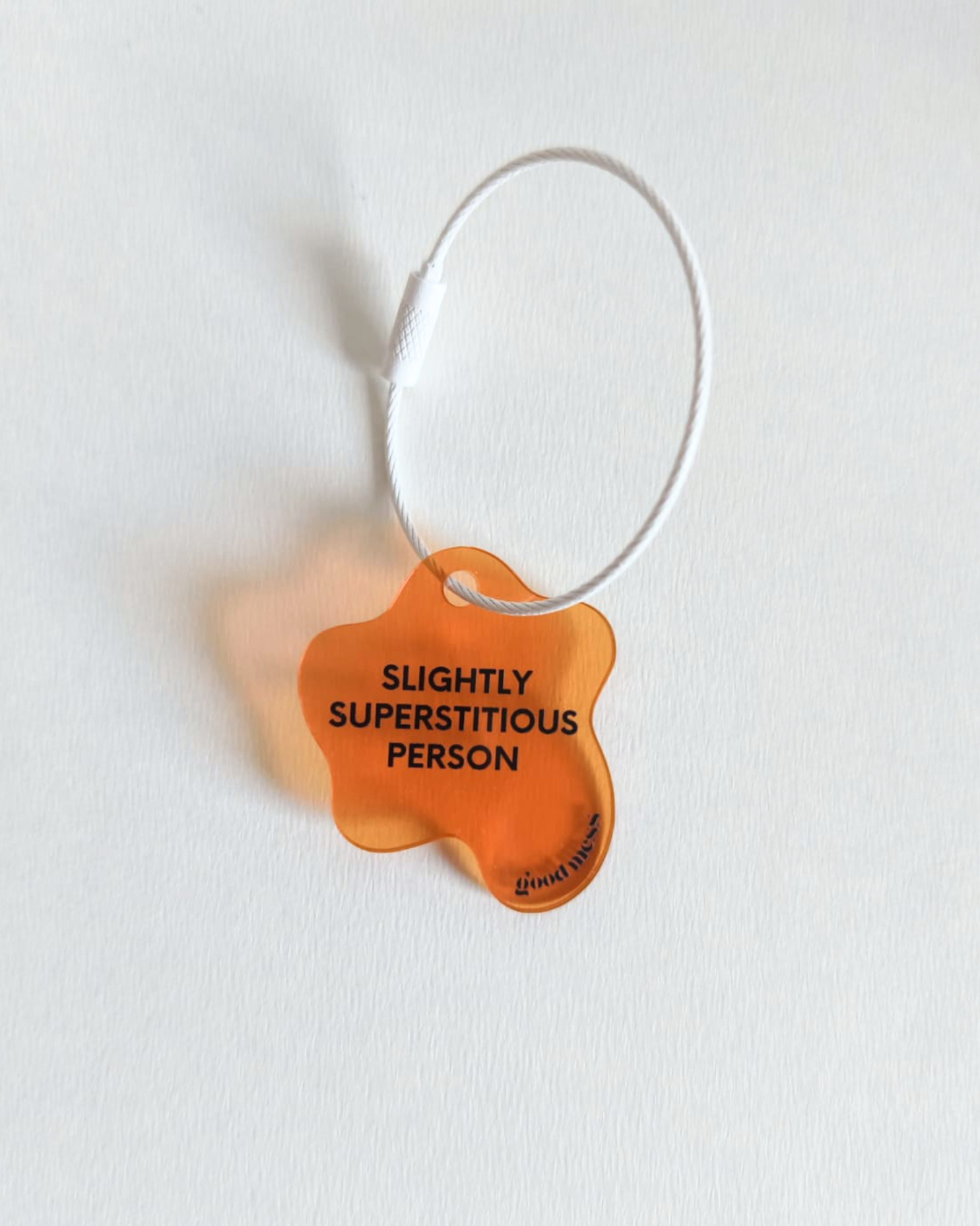 twinning orange acrylic bag charm "Slightly superstitious" for hooman with matching pet collar charm "Rib belly for good luck" for cats and dogs
