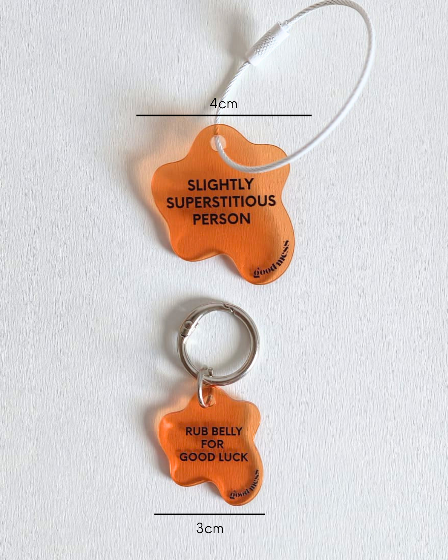orange acrylic matching pet collar charm with twinning witty quotes  "Rib belly for good luck" and bag charm "Slightly superstitious"