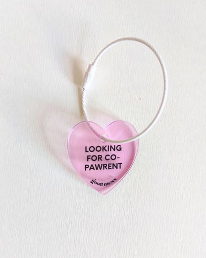 twinning pink heart shape acrylic matching bag charm with words "looking for co-pawrent'. for cats and dogs 